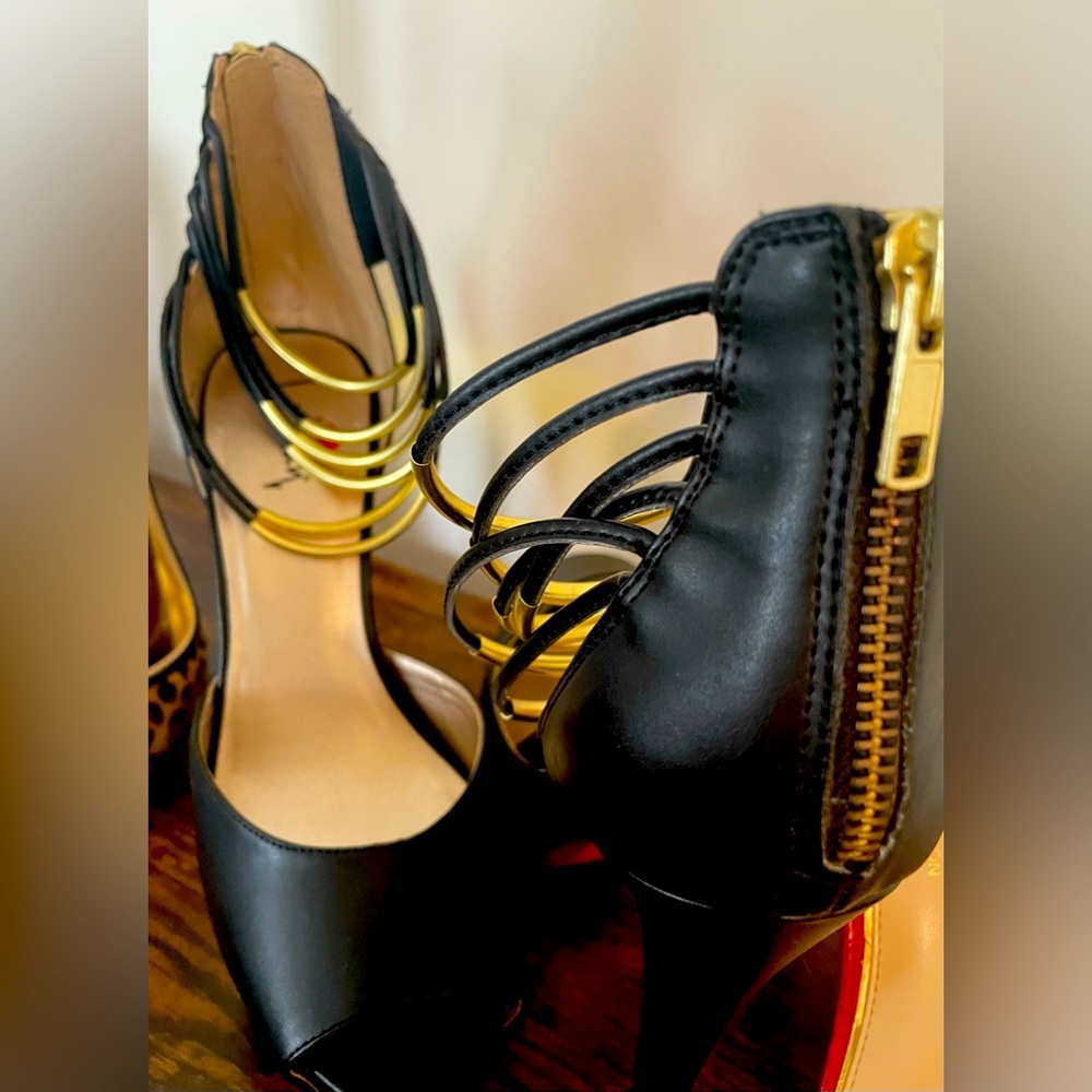 Black open toe strappy ankle heels.